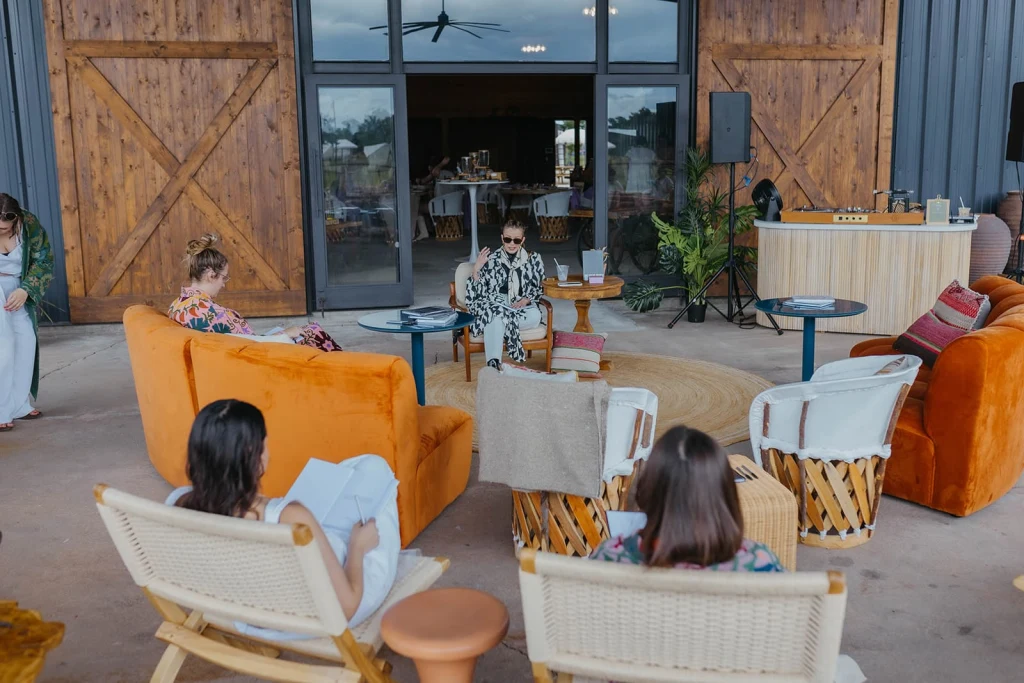 Aerial view of multiple safari tents and cabins arranged across the Rancho Moonrise property for a group retreat
