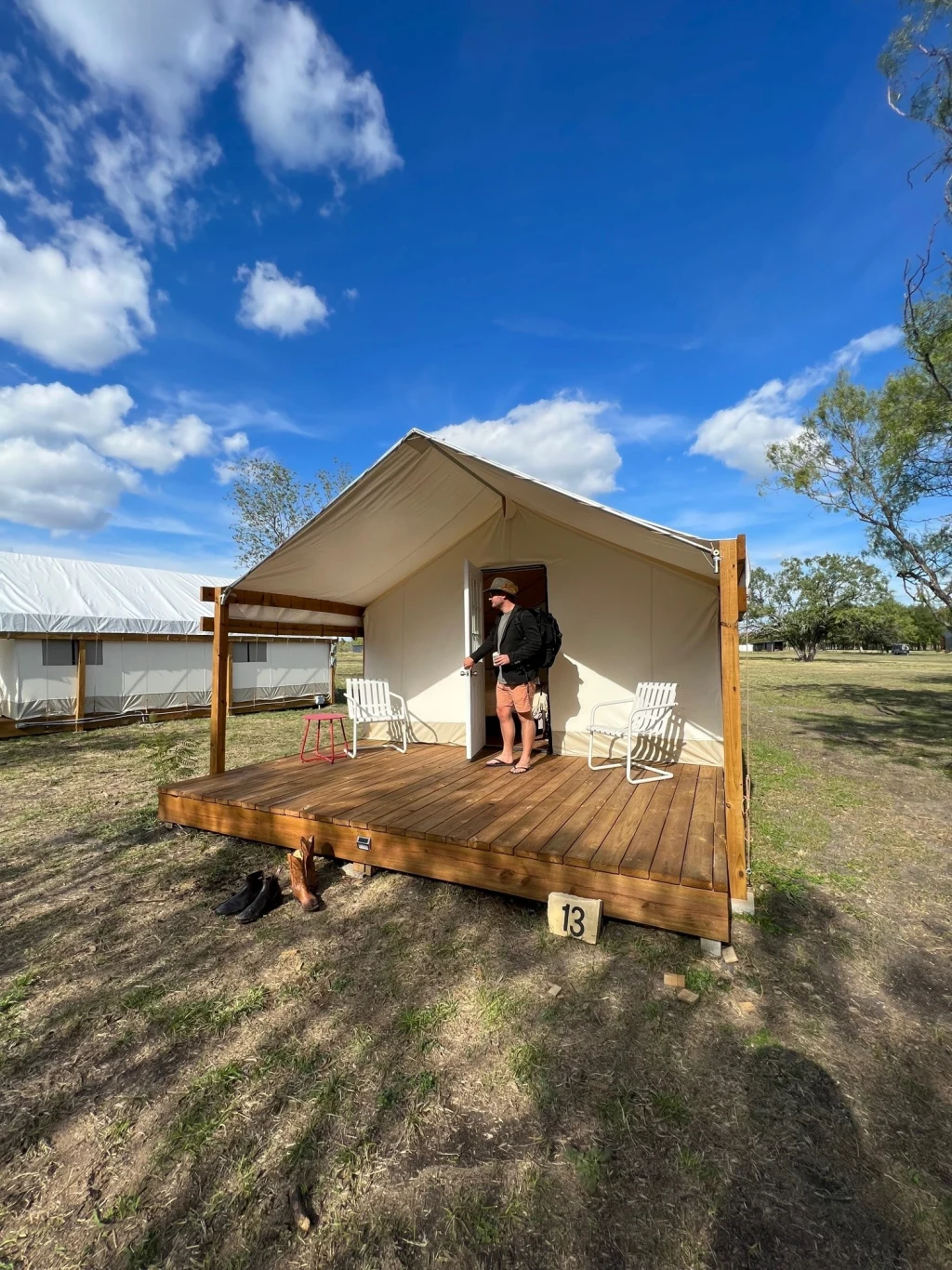 Safari tent exterior with covered deck at Rancho Moonrise