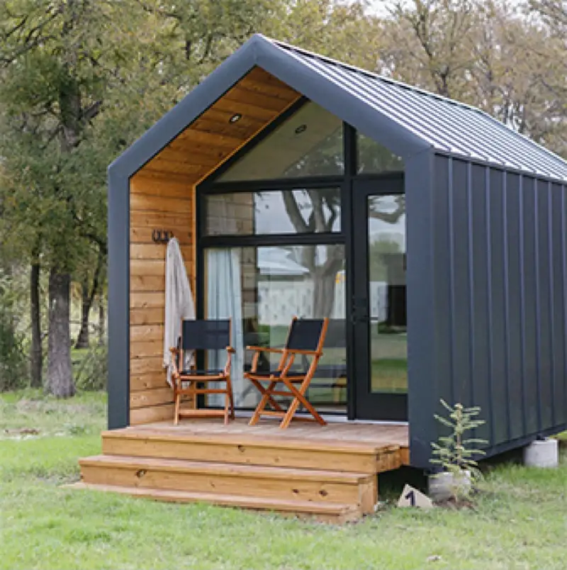 Hand-crafted cabin with covered porch at Rancho Moonrise for wedding guest accommodations
