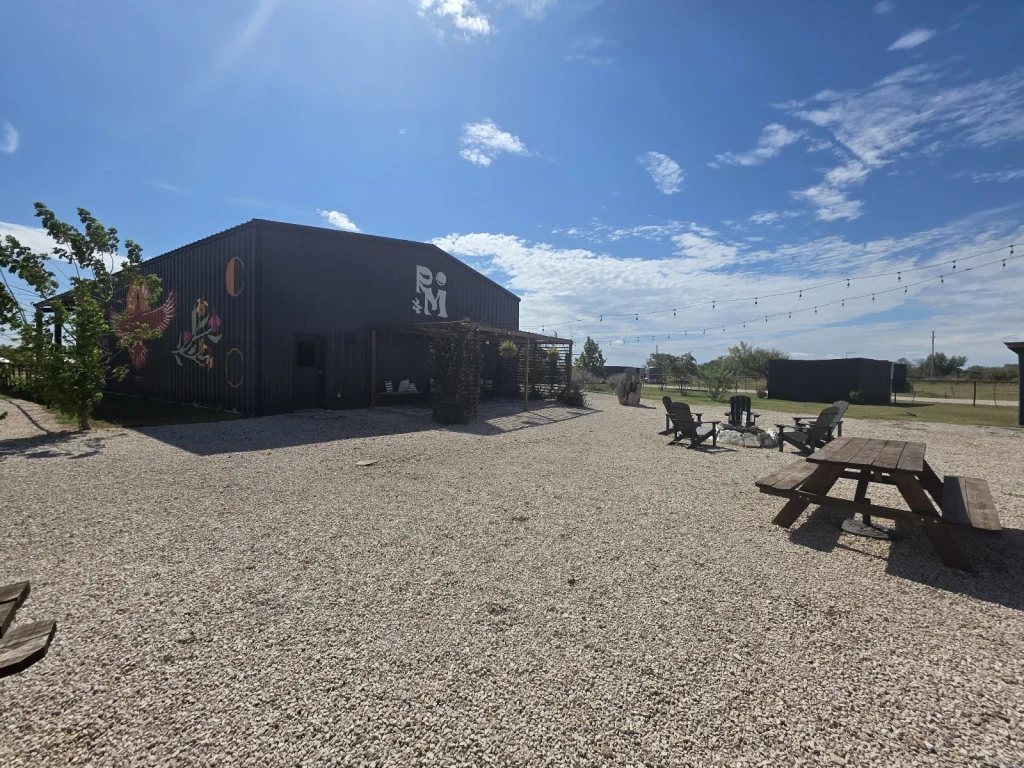 Rancho Moonrise Event Barn exterior with firepit and picnic table