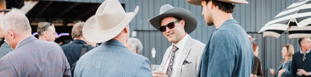 Event Barn interior set up for a corporate dinner with modern ranch decor and string lights at Rancho Moonrise