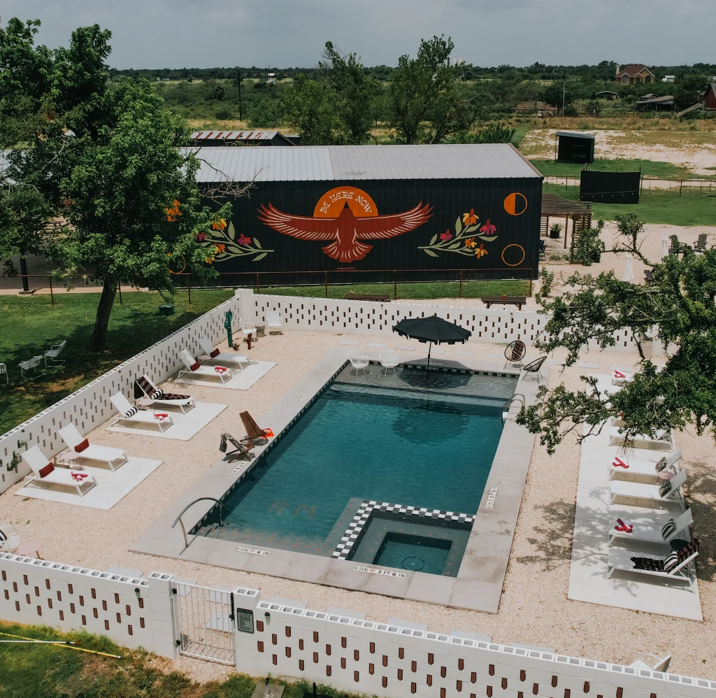 Resort-style pool at Rancho Moonrise under the Texas evening sky
