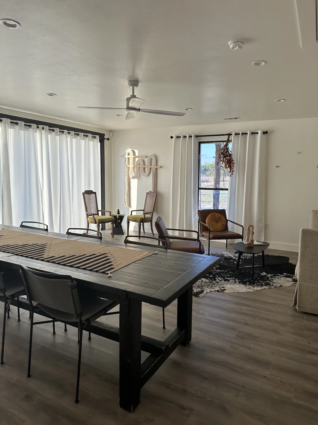 Long dining table and lounge seating inside The Lodge
