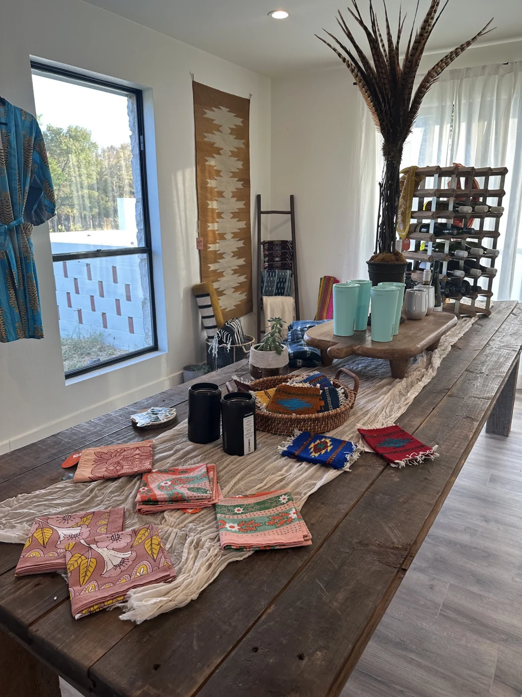 Textile display in The Lodge shop — woven blankets and handmade decor