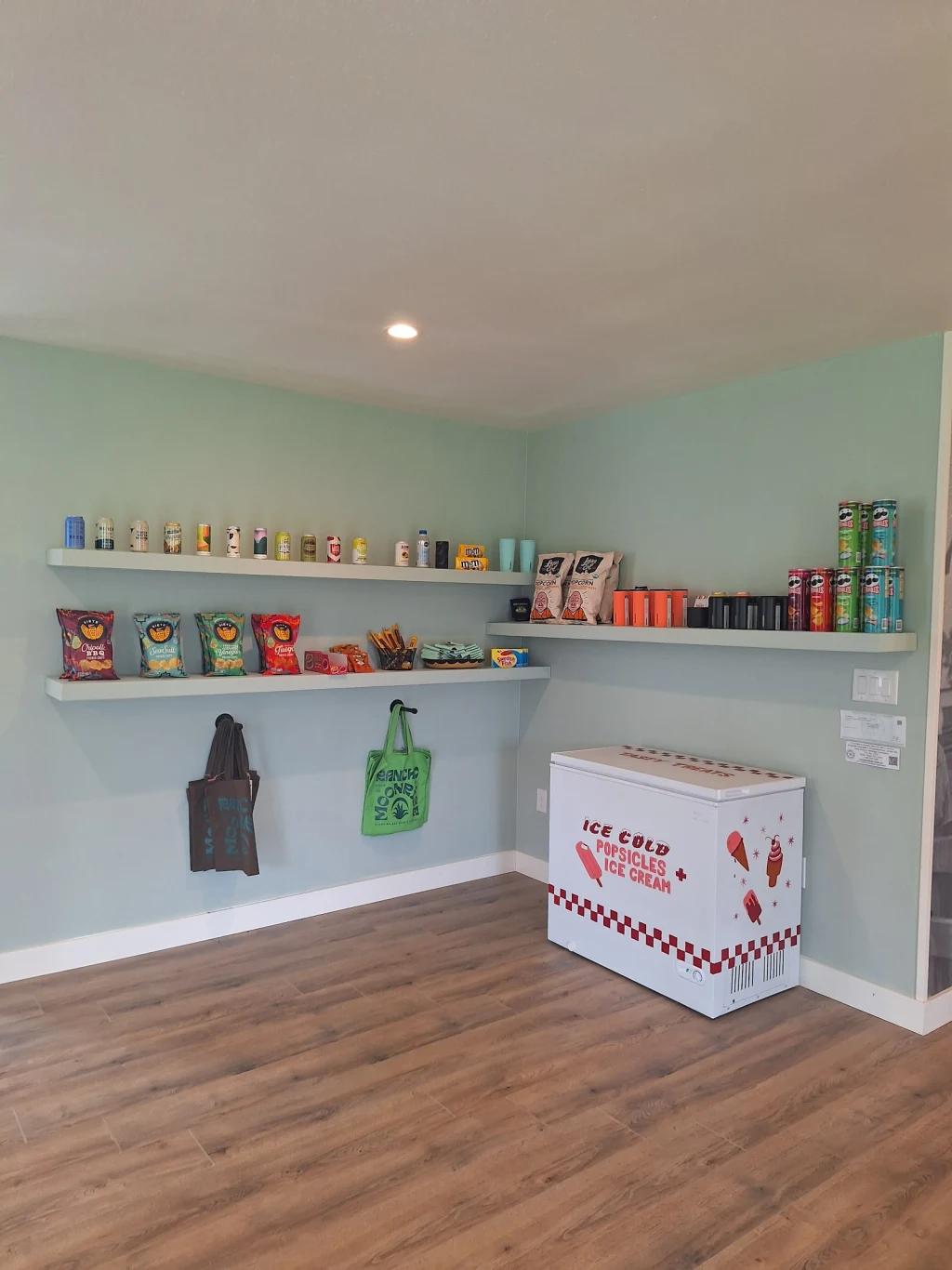 Snack shelves and ice cream cooler inside The Lodge