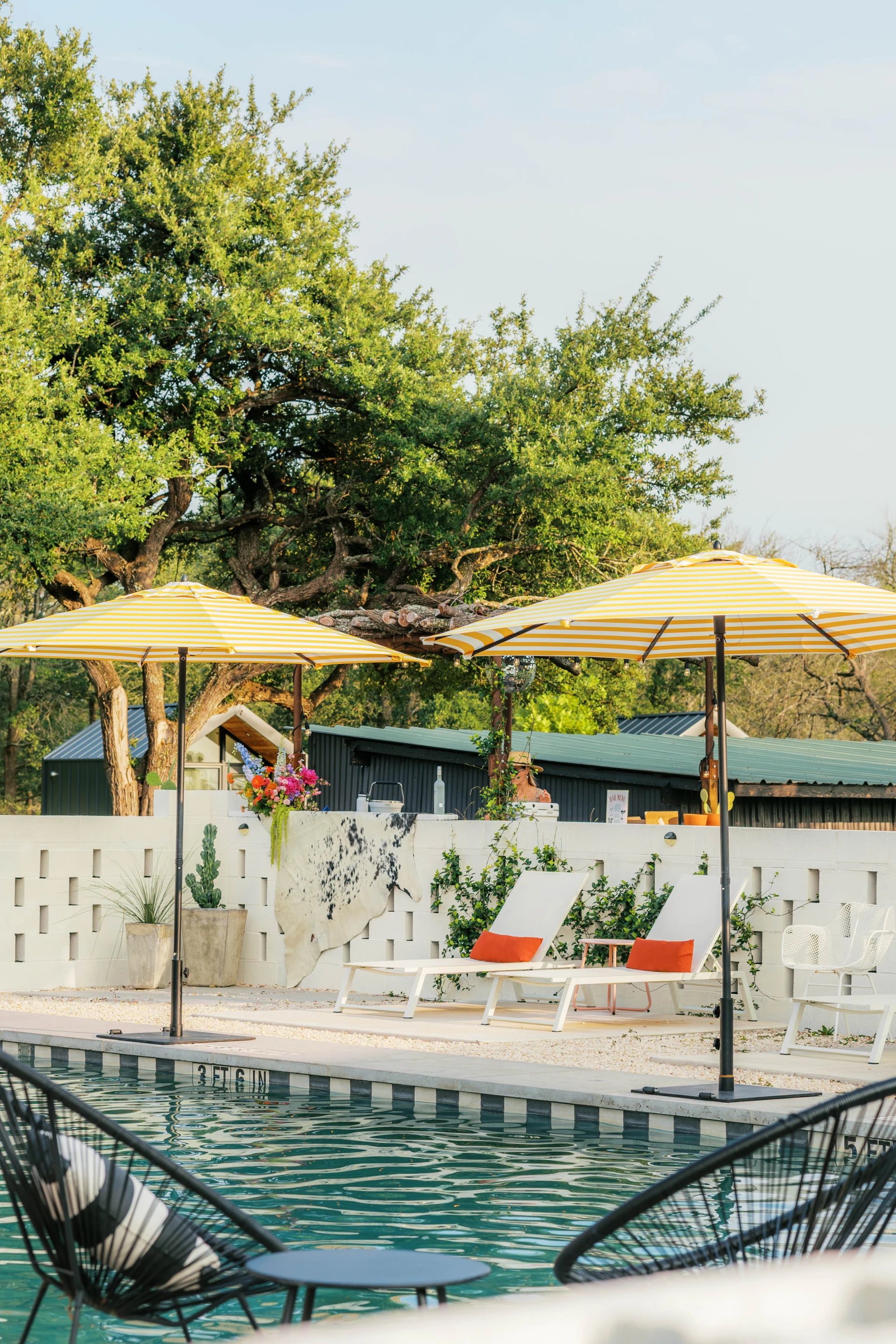 Resort-style pool area at Rancho Moonrise set up for a private poolside event with lounge furniture