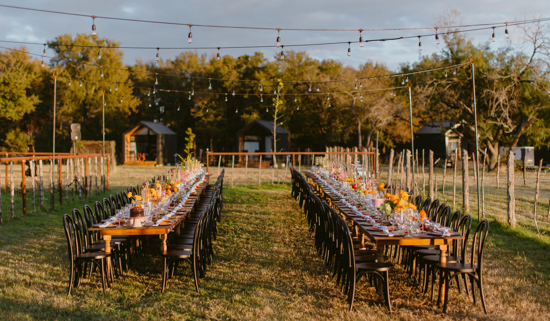 Bride and groom silhouetted against a golden Texas sunset at Rancho Moonrise wedding venue