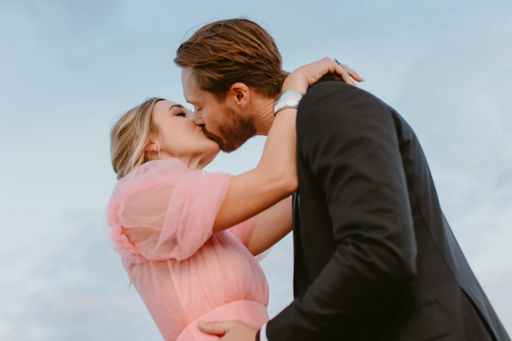 Golden sunset wedding ceremony with string lights at Rancho Moonrise